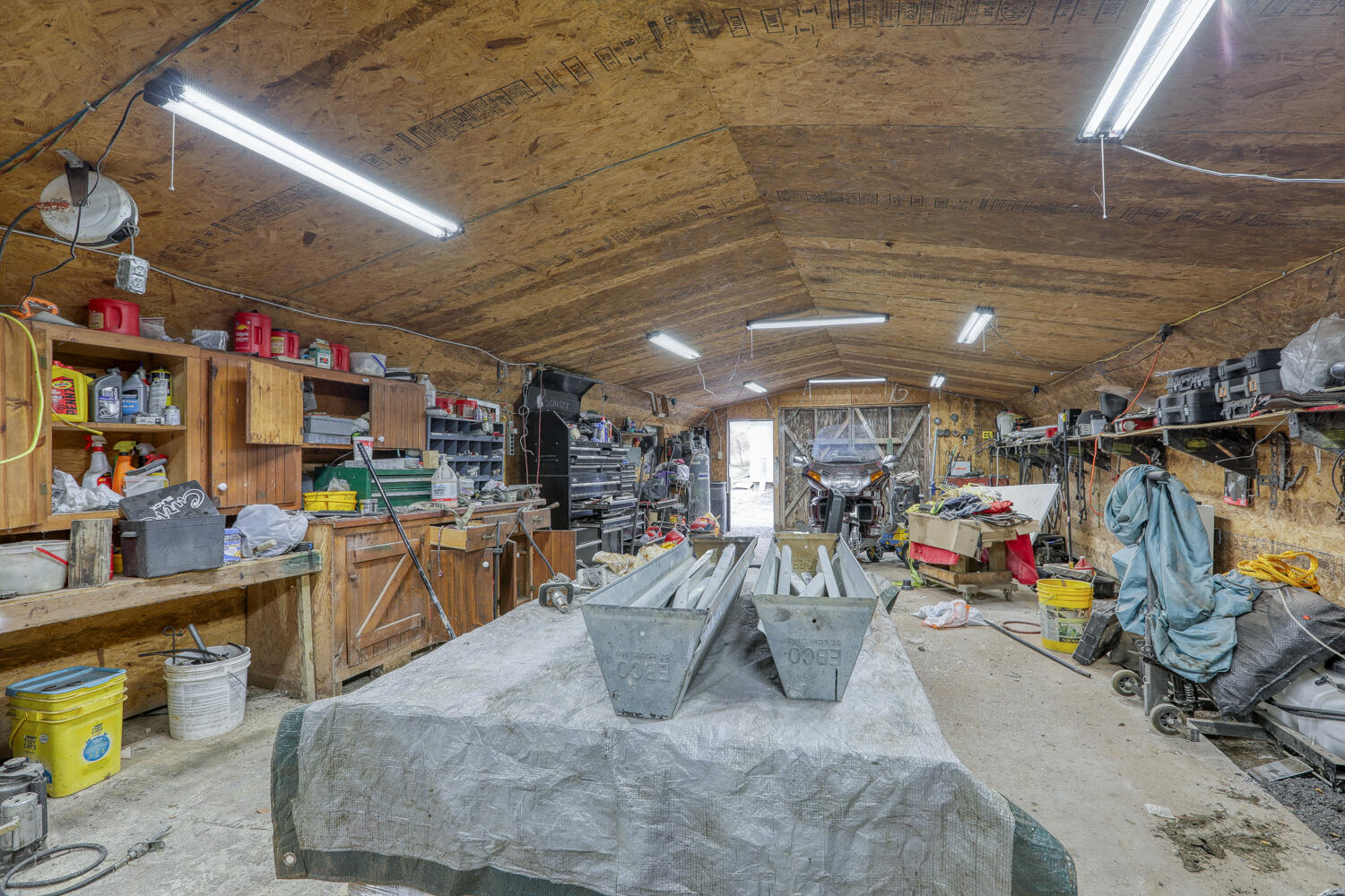 317 Little Pumpkin Valley Road Eidson, TN 37731 - Photo 18 of 85 Inside the gas heated workshop.