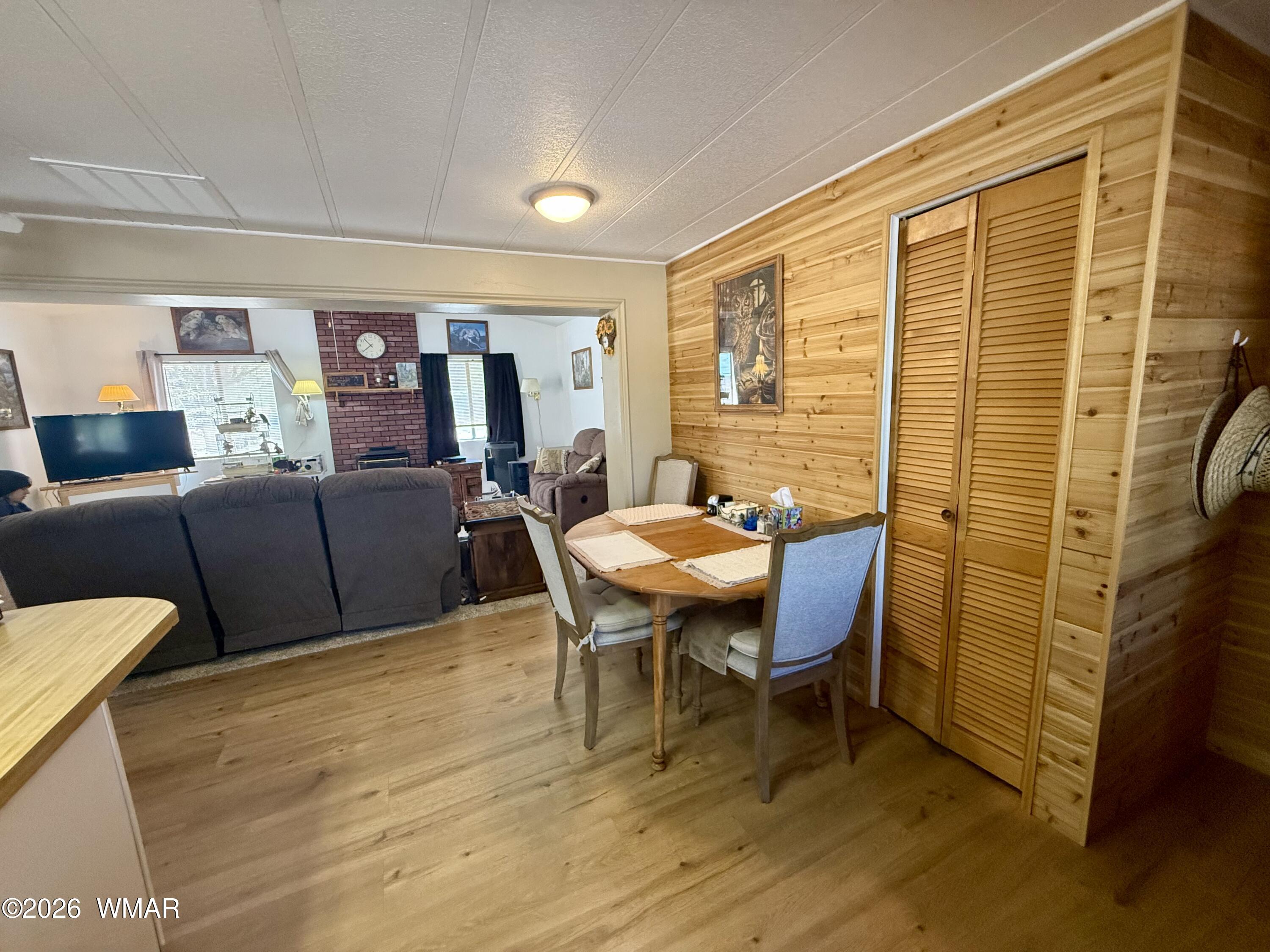 727 South Butler Street Eagar, AZ 85925 - Photo 9 of 32 a view of a dining room with furniture and wooden floor