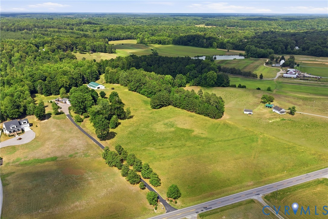 13300 West Patrick Henry Road Doswell, VA 23047 - Photo 62 of 69 Expansive rural landscape featuring a long paved d