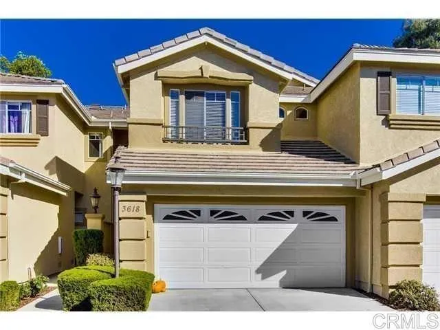 a view of building with glass windows and entryway