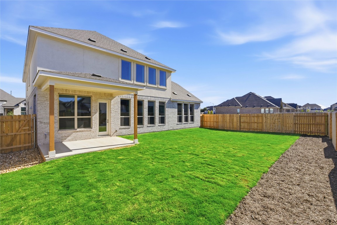 933 Sunny Ridge Drive Leander, TX 78641 - Photo 12 of 16 a view of an house with backyard space and balcony