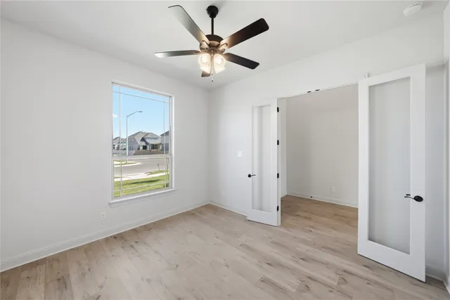 a view of an empty room and window