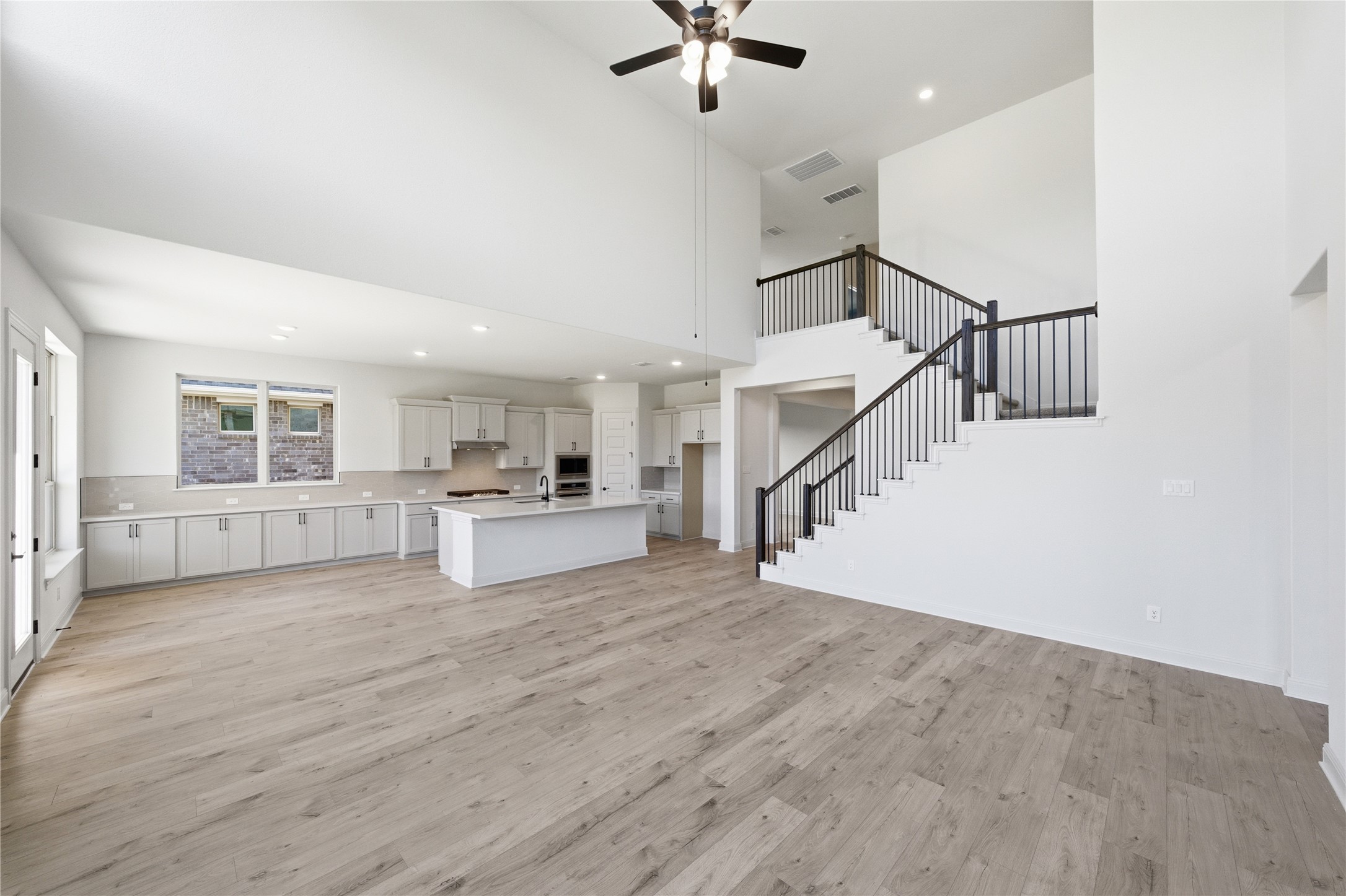 933 Sunny Ridge Drive Leander, TX 78641 - Photo 14 of 16 a view of empty room with wooden floor and ceiling fan