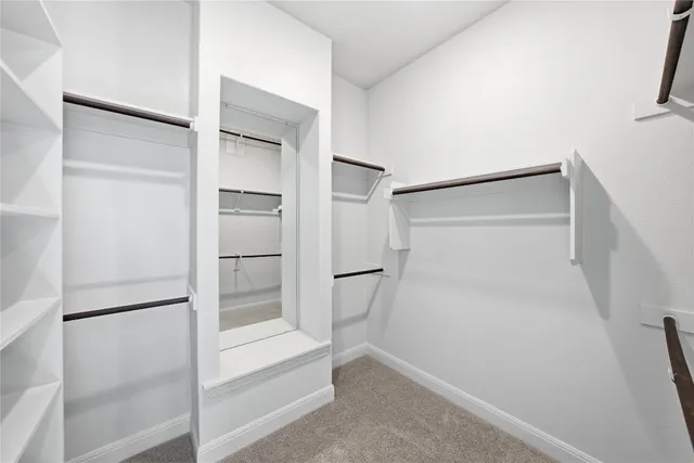 a bathroom with a tub a toilet a sink and shower