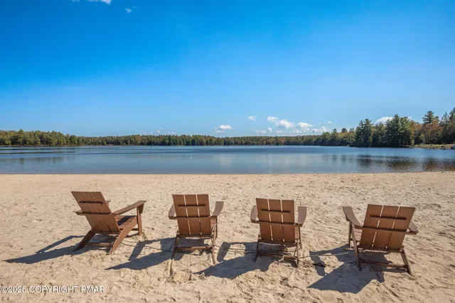 a view of a lake with furniture