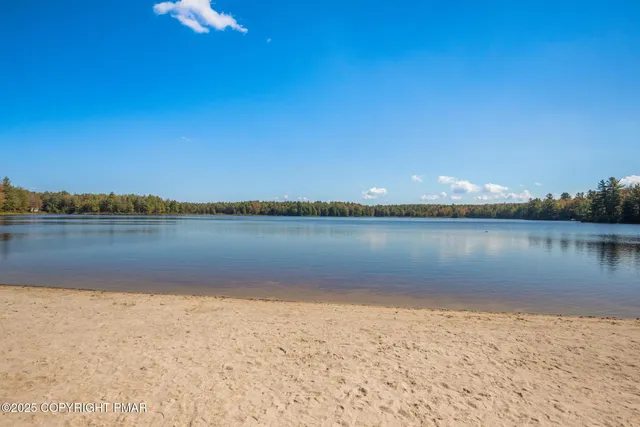 a view of lake with green space