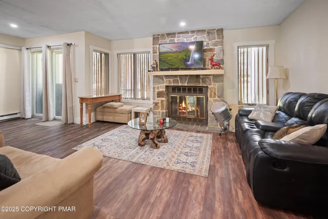 a living room with furniture and a fireplace