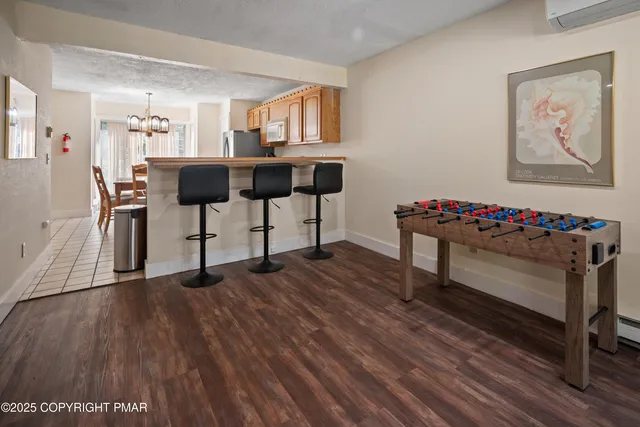 a view of kitchen with furniture and wooden floor
