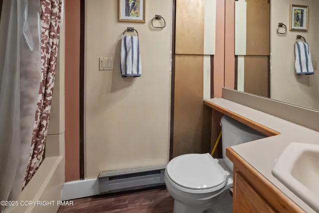 a bathroom with a toilet and a sink