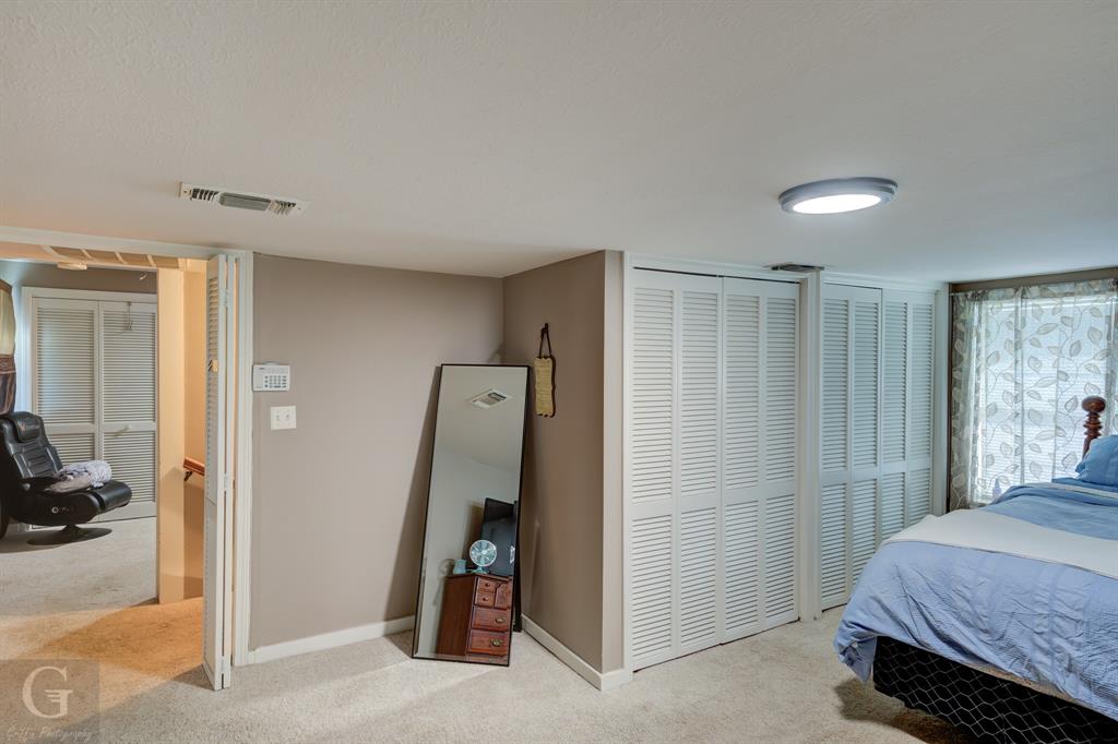 198 Main Street Doyline, LA 71023 - Photo 14 of 26 a bedroom with a bed and a view of bathroom