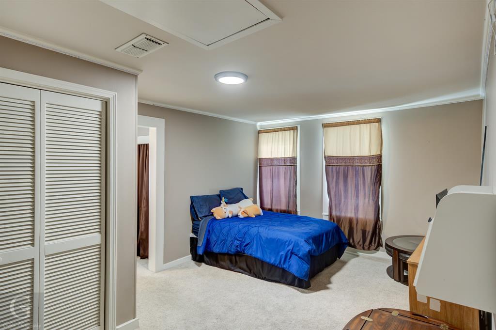 198 Main Street Doyline, LA 71023 - Photo 15 of 26 a bedroom with a large bed and a window