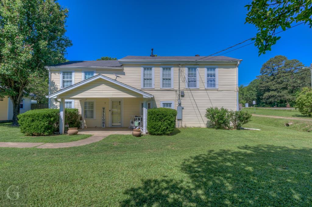 198 Main Street Doyline, LA 71023 - Photo 2 of 26 a front view of a house with a yard