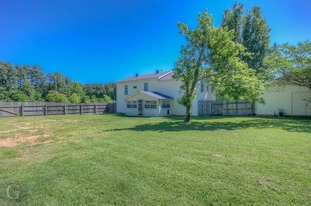 a view of backyard with green space