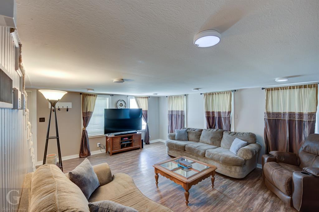 198 Main Street Doyline, LA 71023 - Photo 5 of 26 a living room with furniture and a flat screen tv