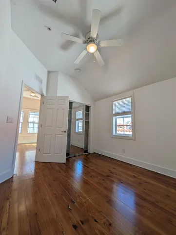 a view of room with wooden floor