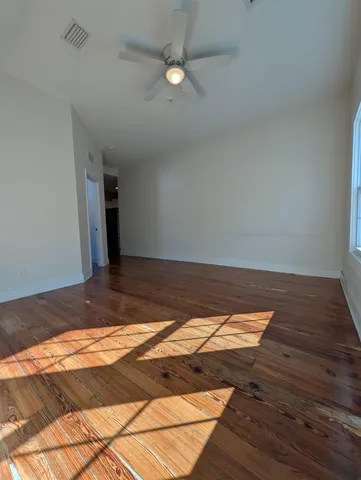 a view of a livingroom with furniture and staircase