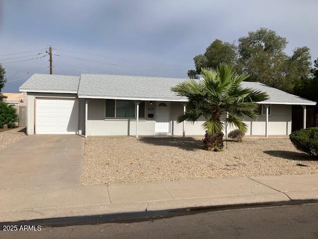 824 West Parkway Boulevard Tempe, AZ 85281 - Photo 2 of 28 a front view of a house with a yard and garage