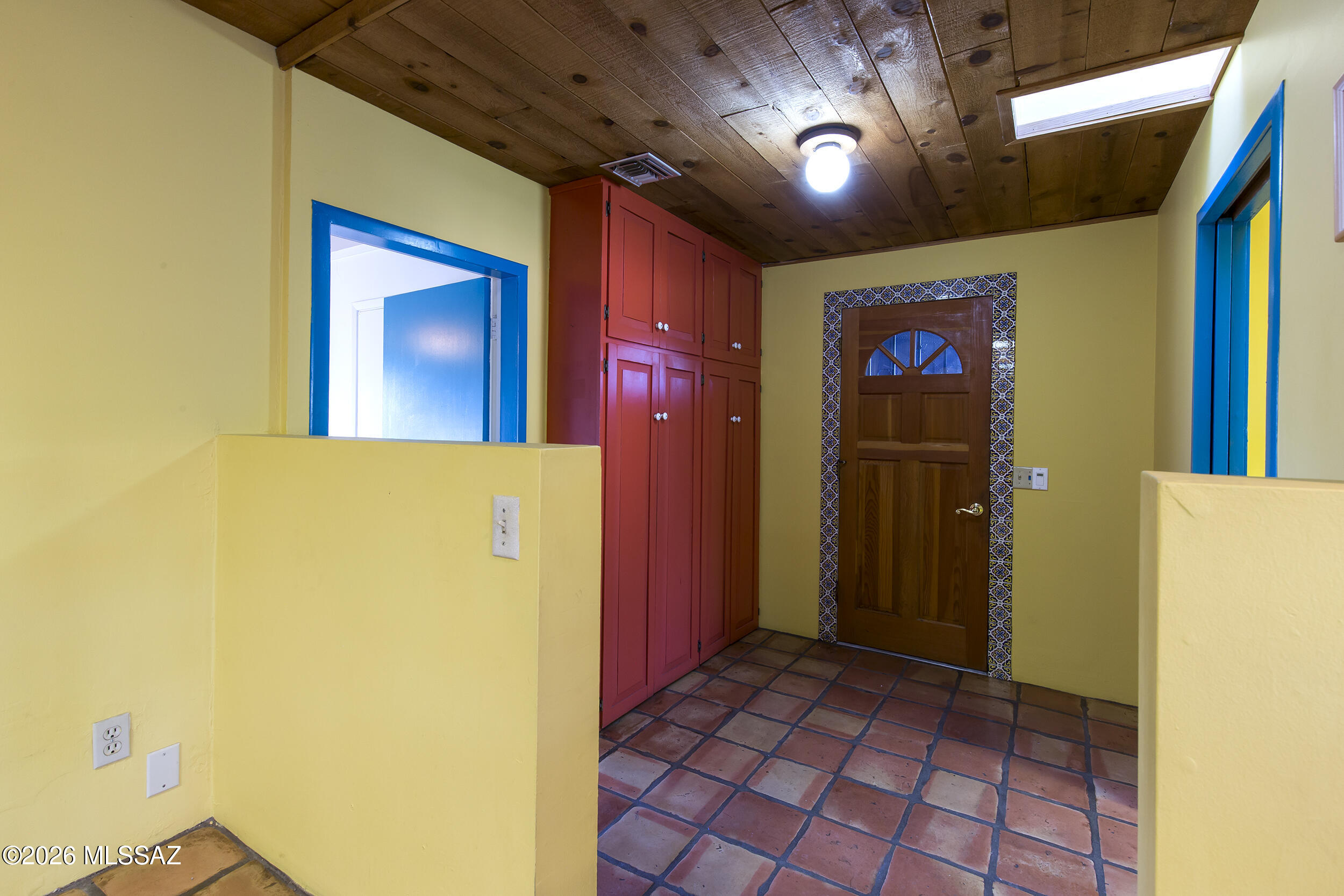 4130 East River Road Tucson, AZ 85718 - Photo 21 of 46 a view of a hallway with a yellow & plant