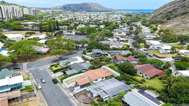 an aerial view of residential houses with outdoor space