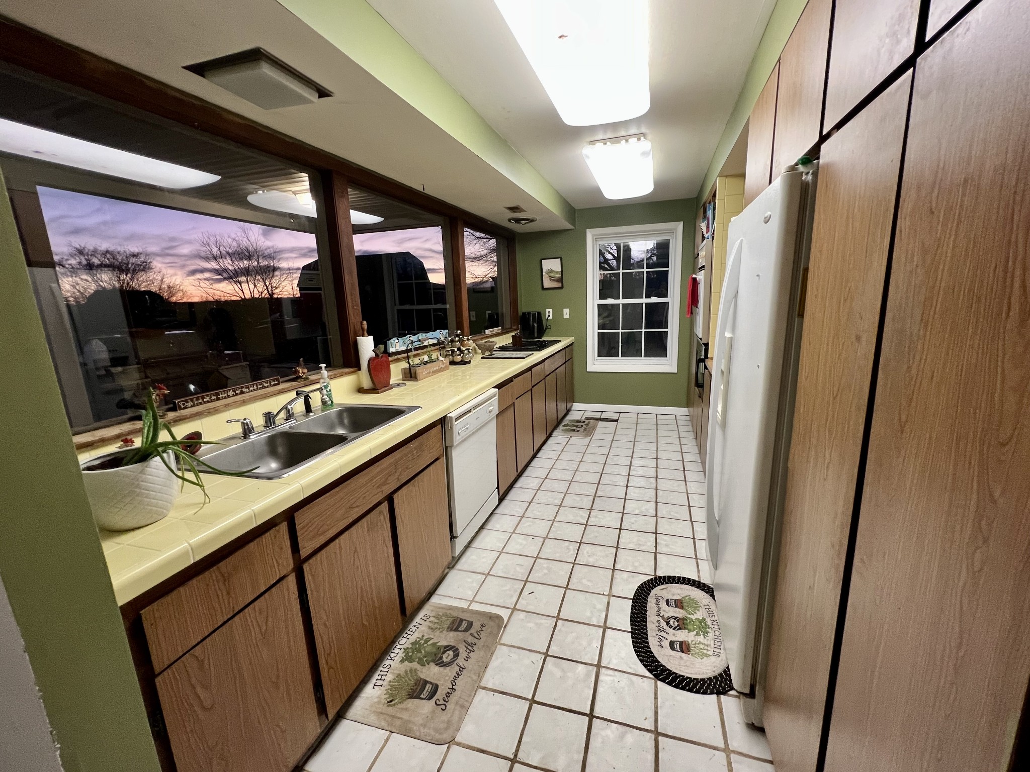 1097 Kennedy Road Manchester, TN 37355 - Photo 12 of 20 a large white kitchen with a sink and a large window
