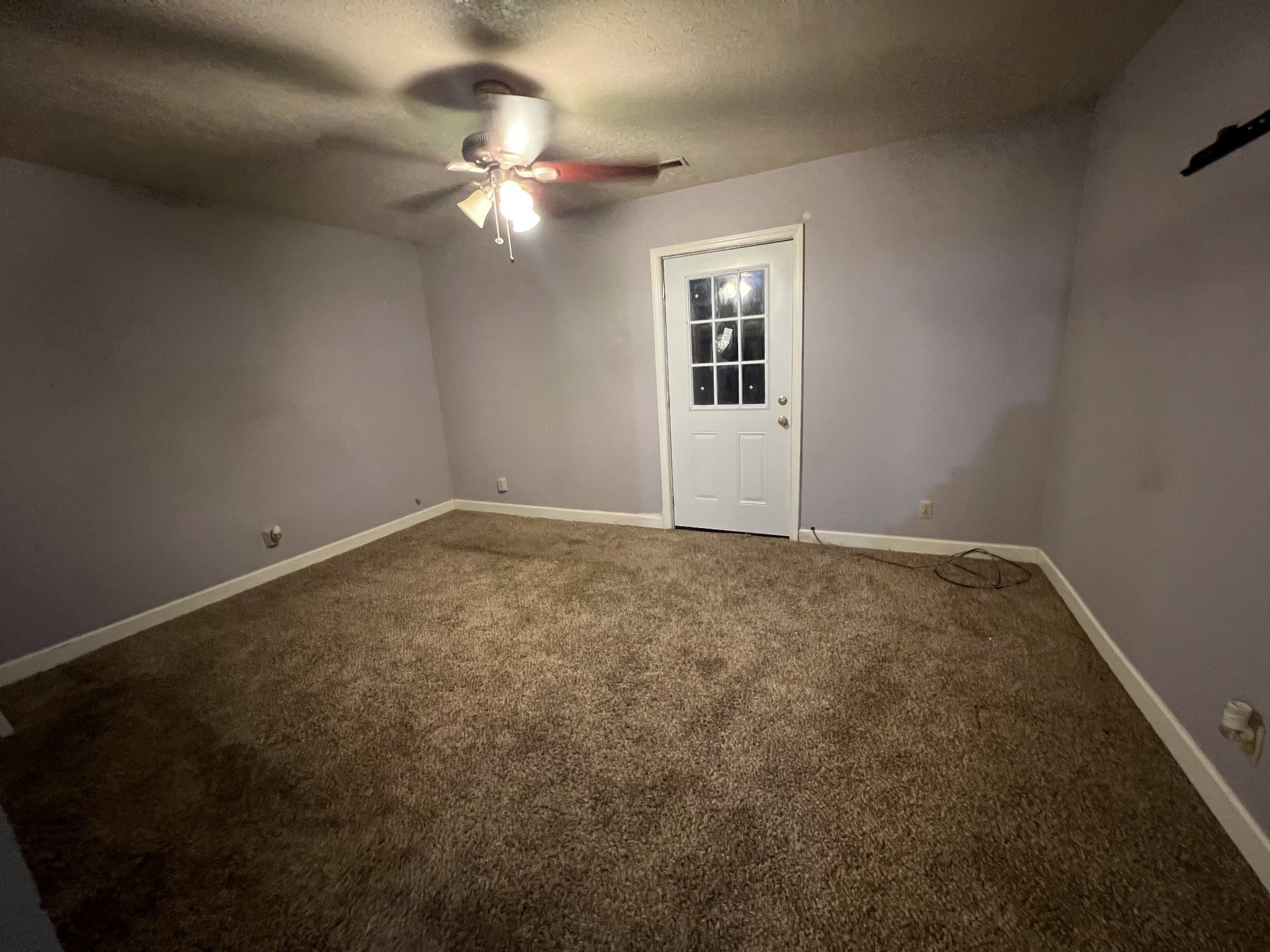 1097 Kennedy Road Manchester, TN 37355 - Photo 14 of 20 an empty room with windows and chandelier fan