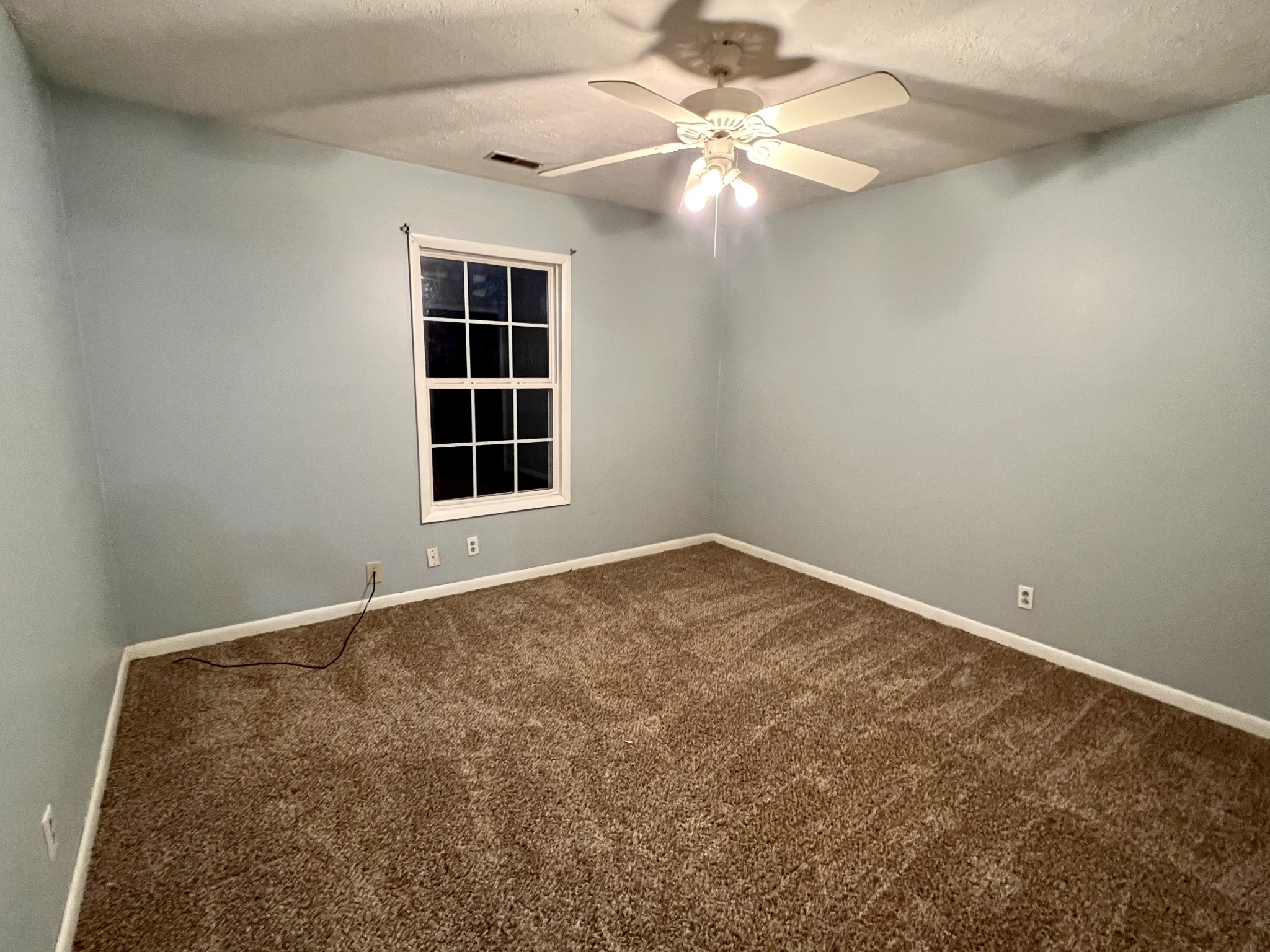 1097 Kennedy Road Manchester, TN 37355 - Photo 17 of 20 an empty room with a window and a ceiling fan