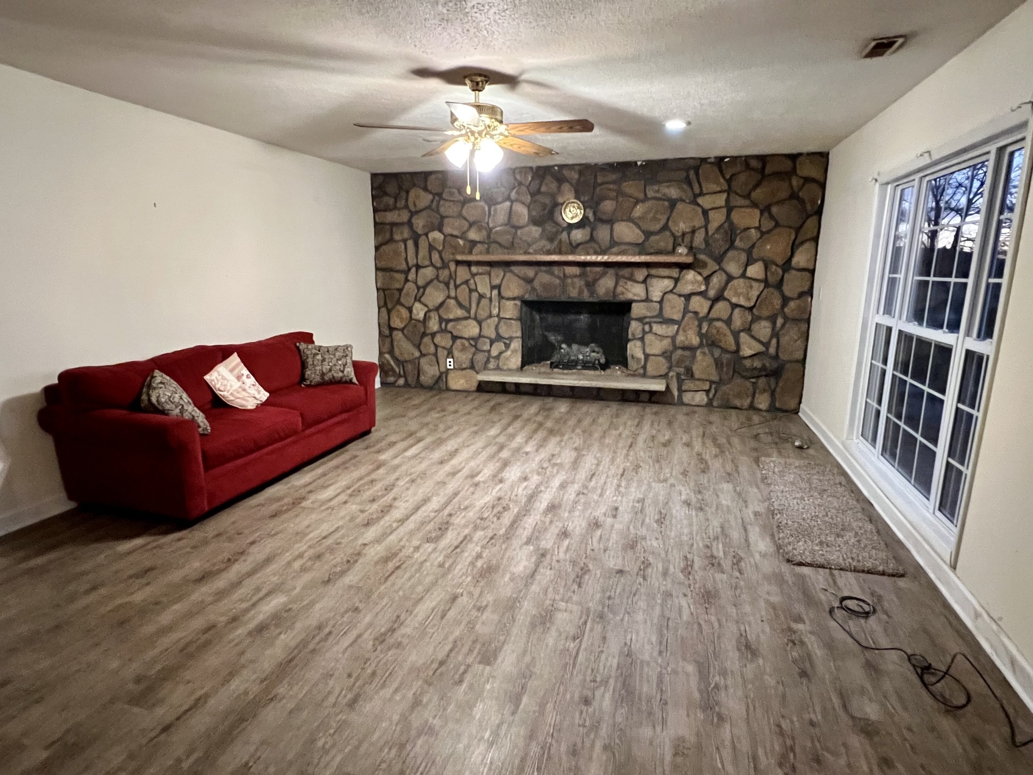 1097 Kennedy Road Manchester, TN 37355 - Photo 6 of 20 a living room with furniture a fireplace and a flat screen tv