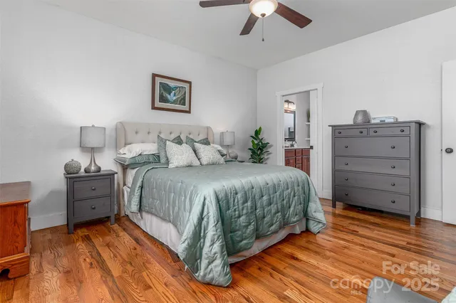 a bathroom with a double vanity sink toilet and a mirror
