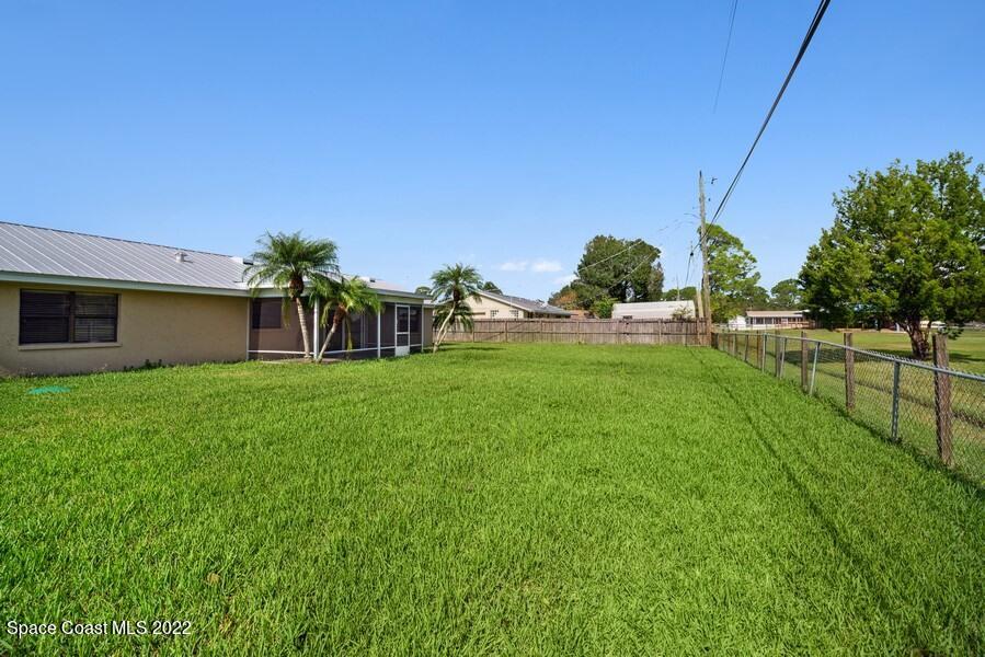 1840 Britt Road Cocoa, FL 32926 - Photo 13 of 17 a backyard of a house with table and chairs