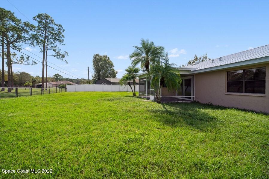 1840 Britt Road Cocoa, FL 32926 - Photo 14 of 17 a view of a house with a backyard