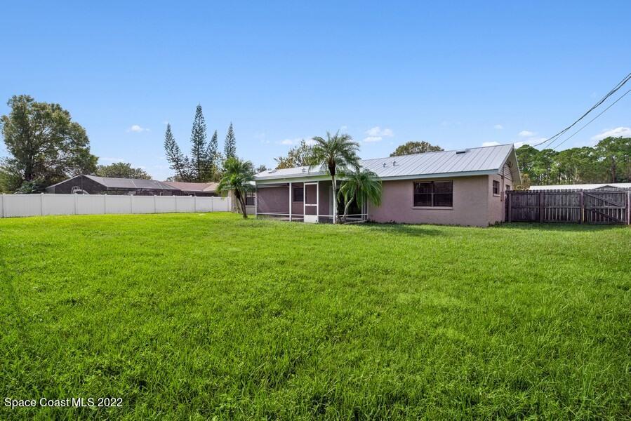 1840 Britt Road Cocoa, FL 32926 - Photo 15 of 17 a view of a house with a yard porch and sitting area