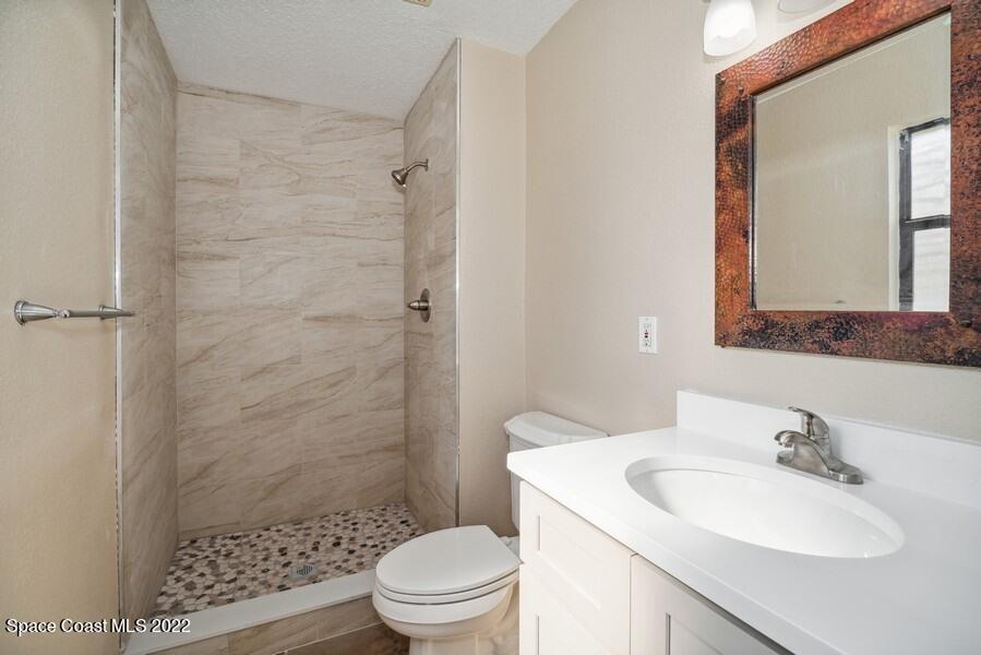 1840 Britt Road Cocoa, FL 32926 - Photo 8 of 17 a bathroom with a sink toilet and shower
