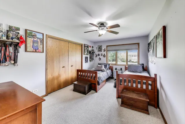 a bedroom with furniture and a chandelier