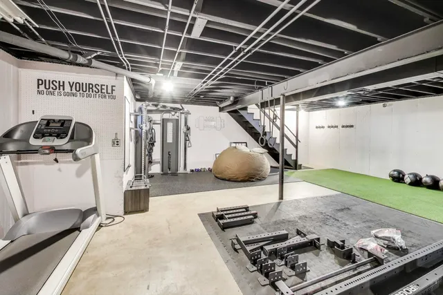 a view of a house with a yard and sitting area