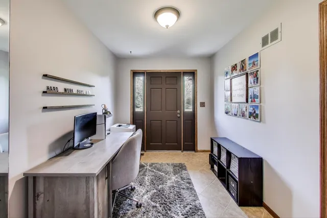 a living room with a fireplace furniture and a window