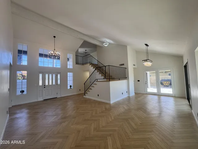 a view of a hallway to rooms