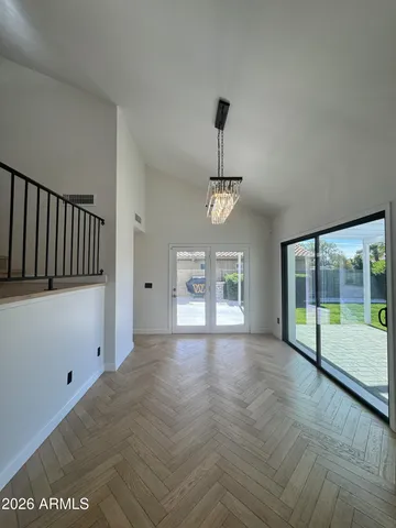 a view of a hallway view with wooden floor and staircase