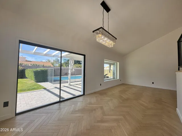 a view of empty room with a fireplace