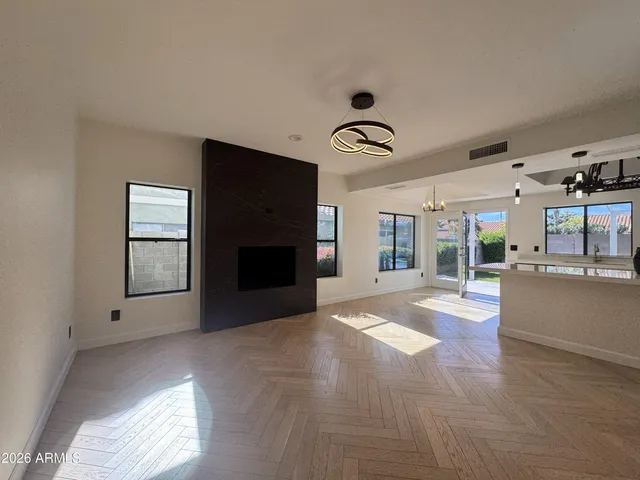 a kitchen with stainless steel appliances a sink a stove top oven a counter space and cabinets