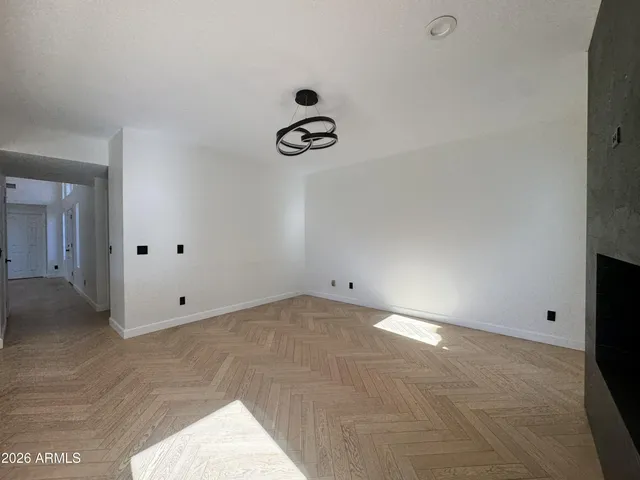 a view of an empty room with a window