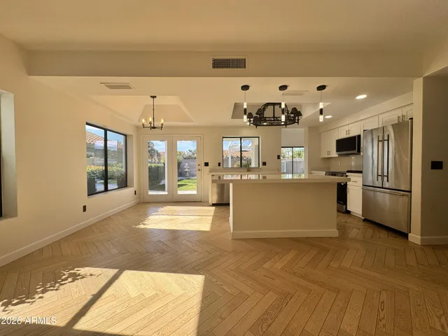 a view of a room with window and wooden floor