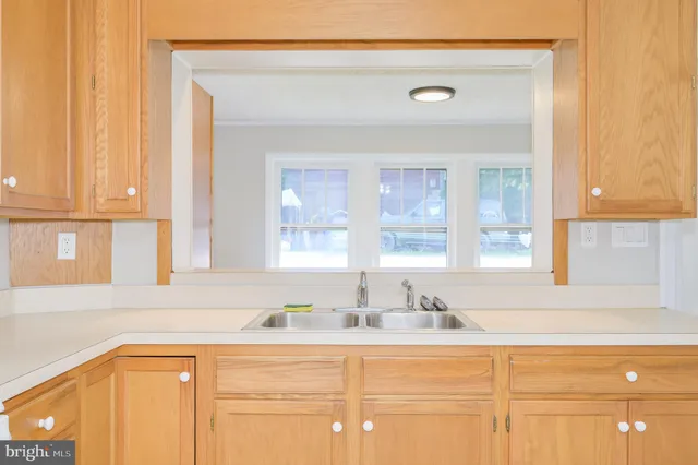 an empty room with a fan and a ceiling fan