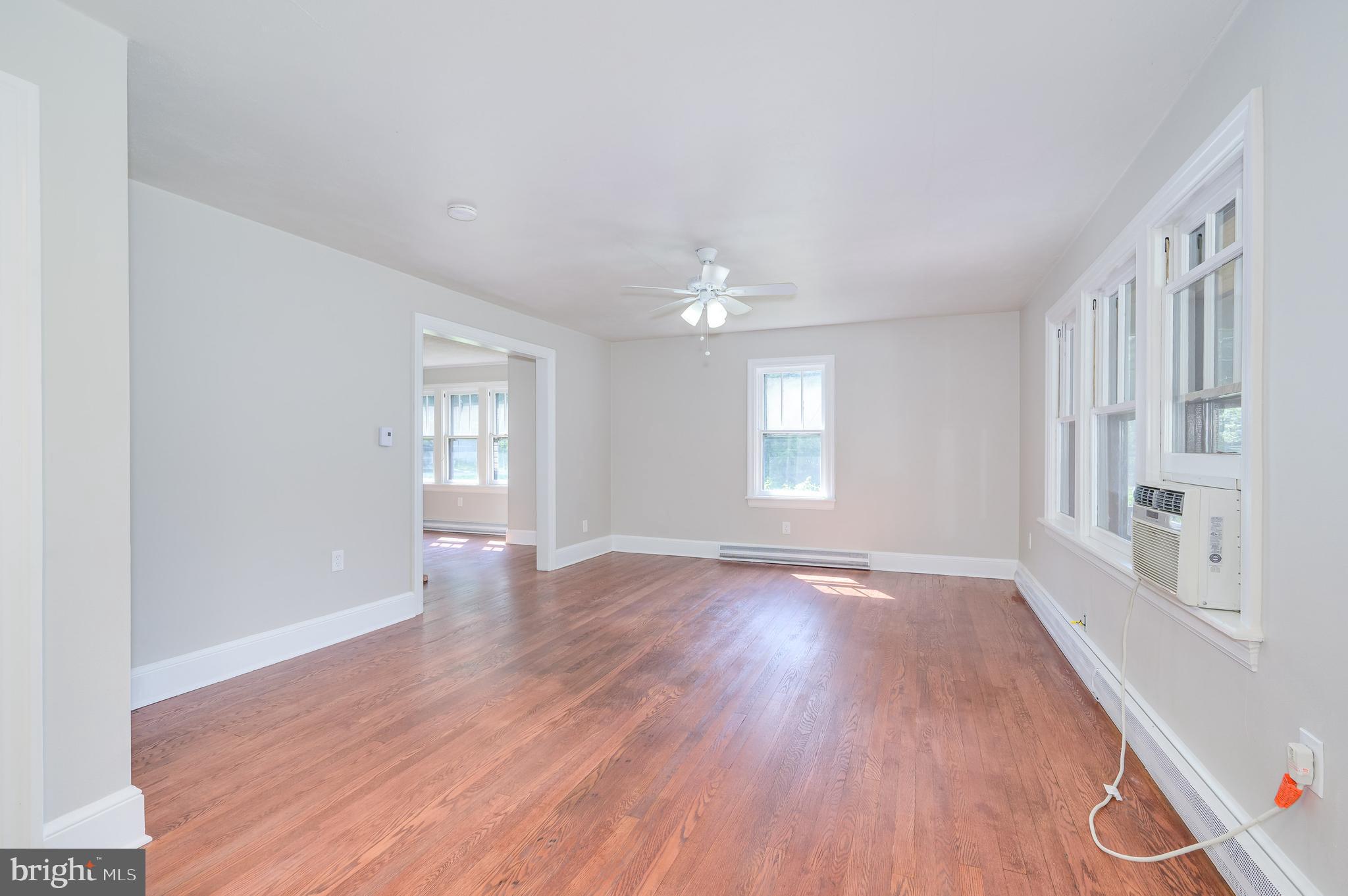 14 Peer Lane Berkeley Springs, WV 25411 - Photo 19 of 52 a view of an empty room with wooden floor and a window