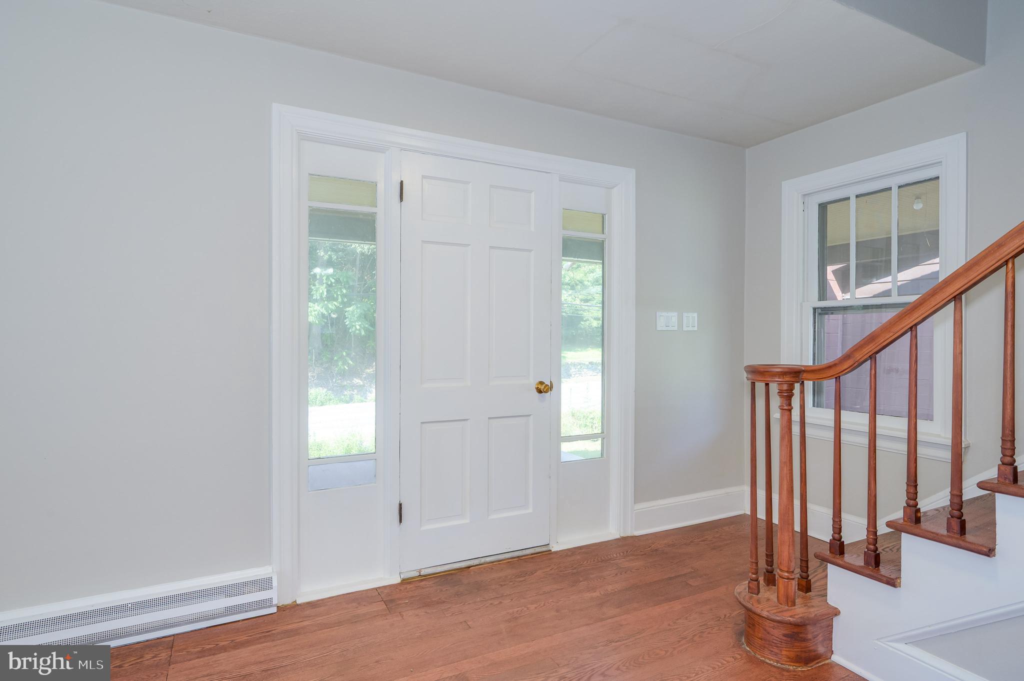 14 Peer Lane Berkeley Springs, WV 25411 - Photo 21 of 52 an empty room with wooden floor and windows