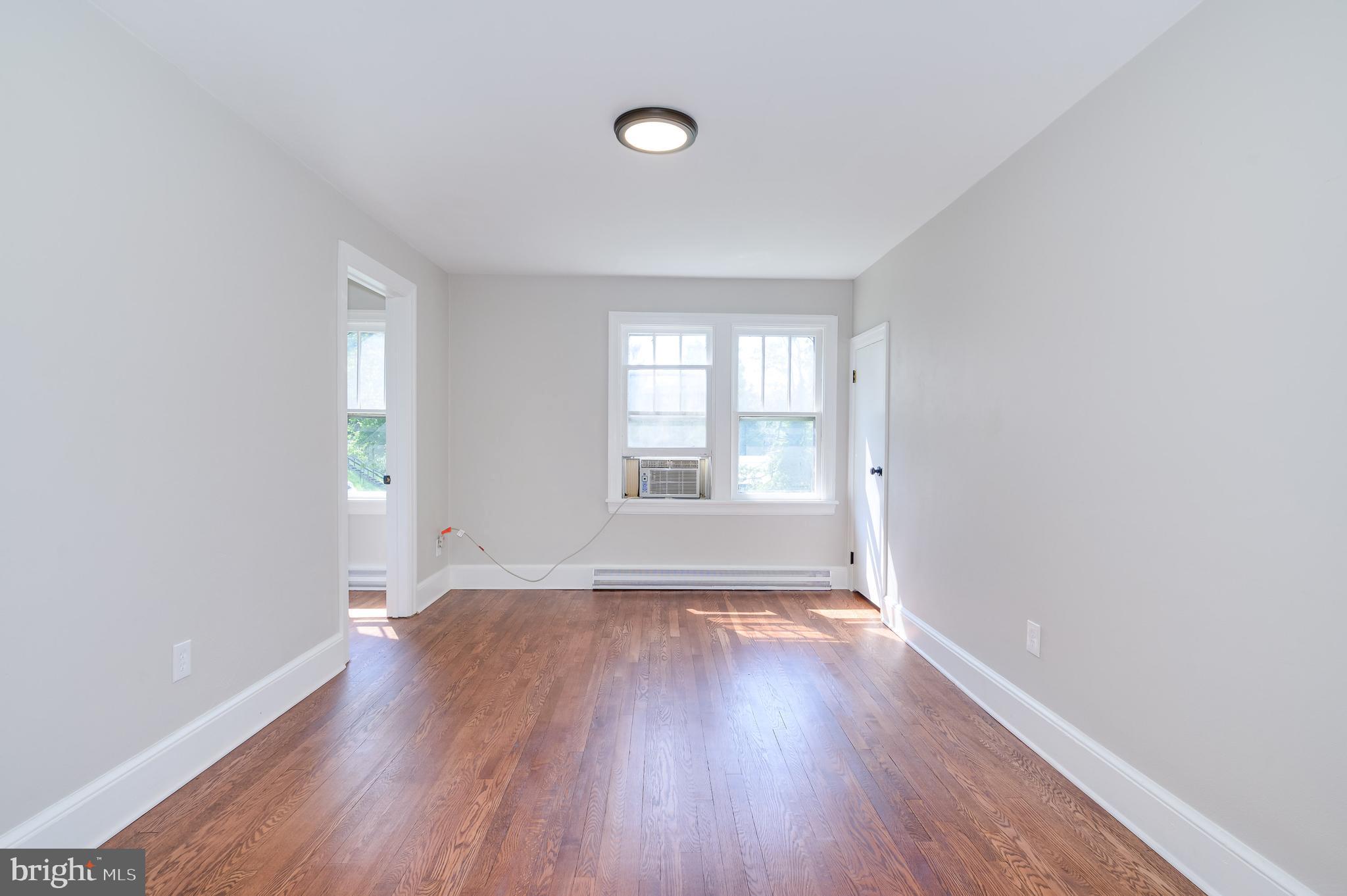 14 Peer Lane Berkeley Springs, WV 25411 - Photo 25 of 52 an empty room with wooden floor and windows