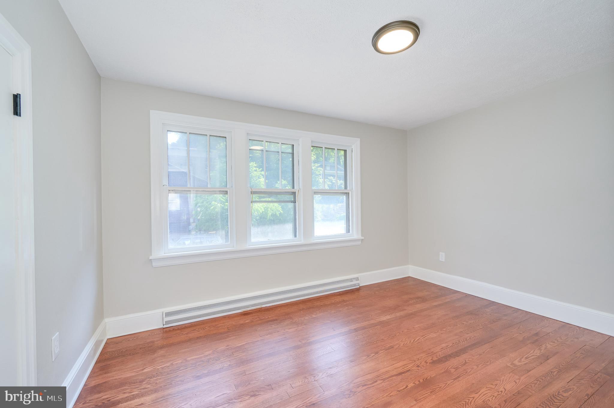 14 Peer Lane Berkeley Springs, WV 25411 - Photo 28 of 52 an empty room with wooden floor and windows