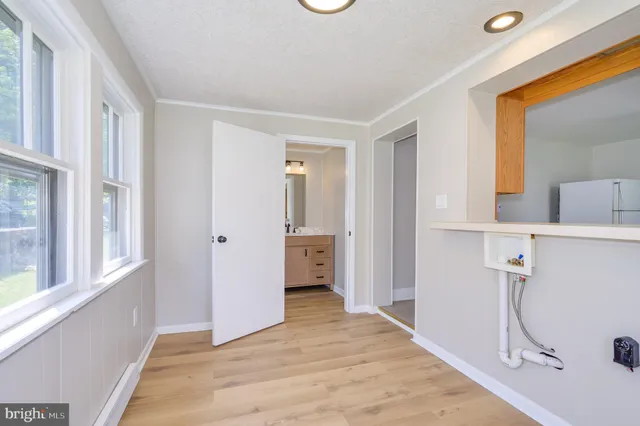 a view of a room with a sink and a window