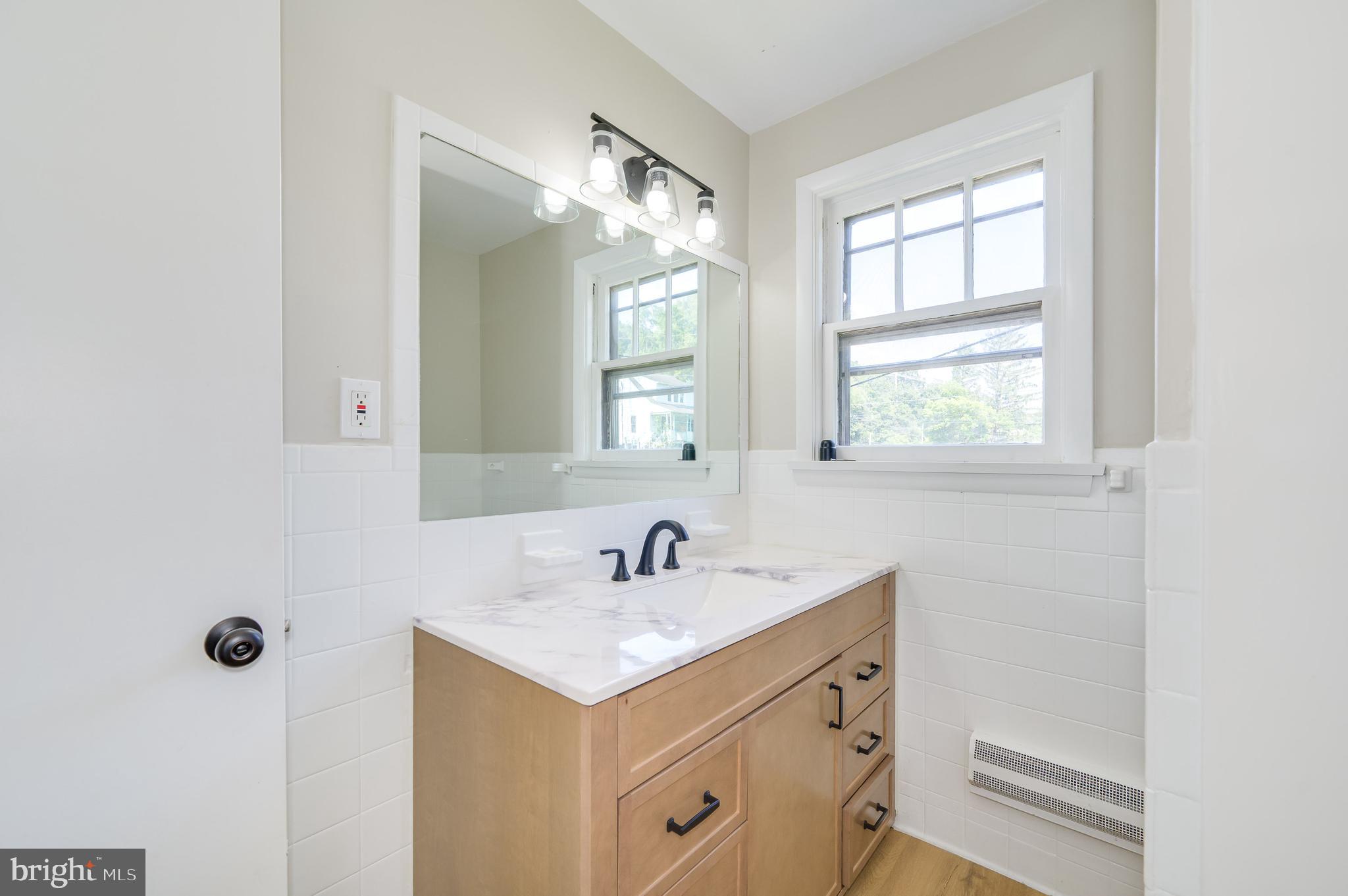 14 Peer Lane Berkeley Springs, WV 25411 - Photo 31 of 52 a bathroom with a sink and a mirror
