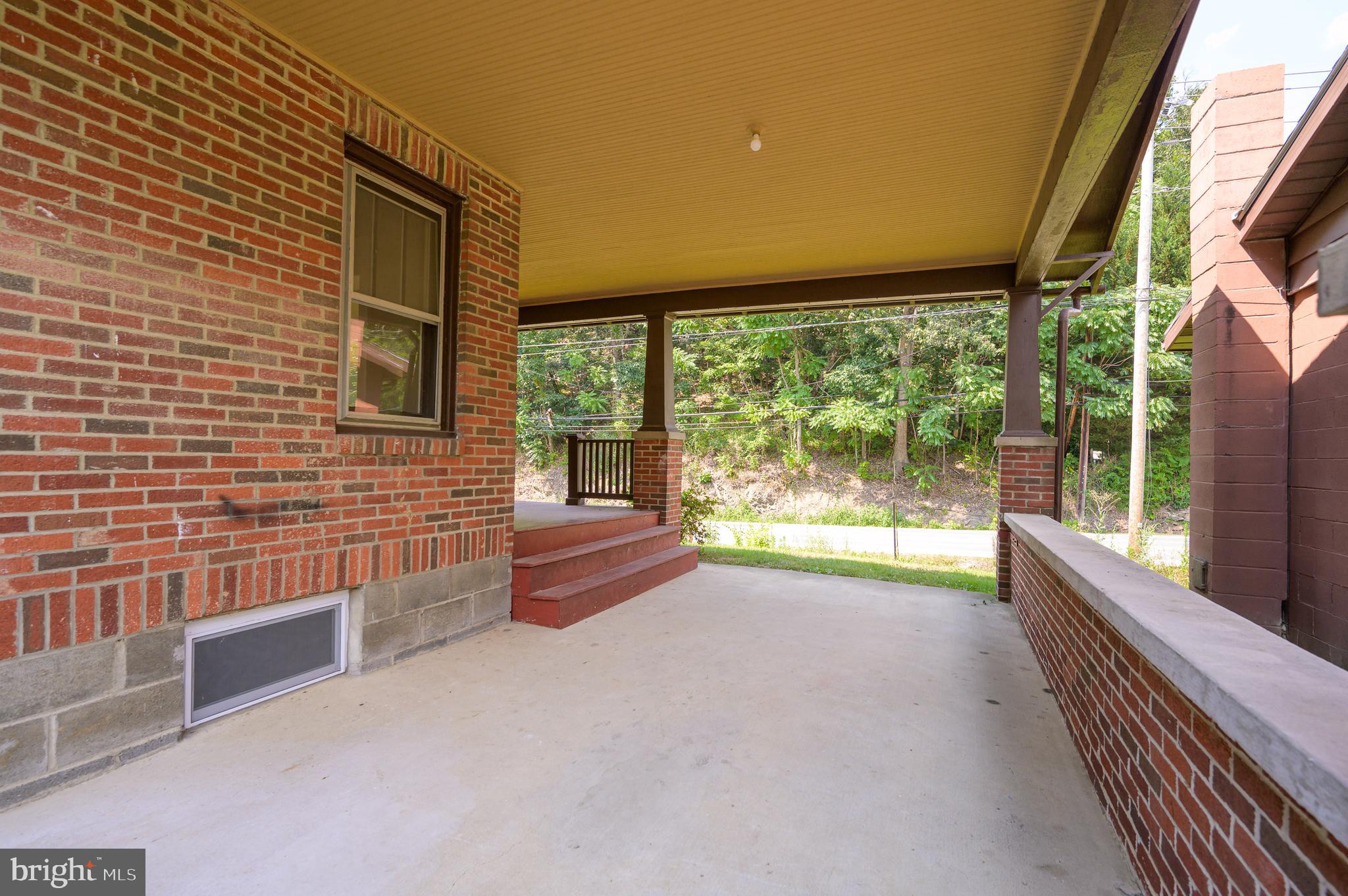 14 Peer Lane Berkeley Springs, WV 25411 - Photo 39 of 52 a view of front door and porch with wooden floor