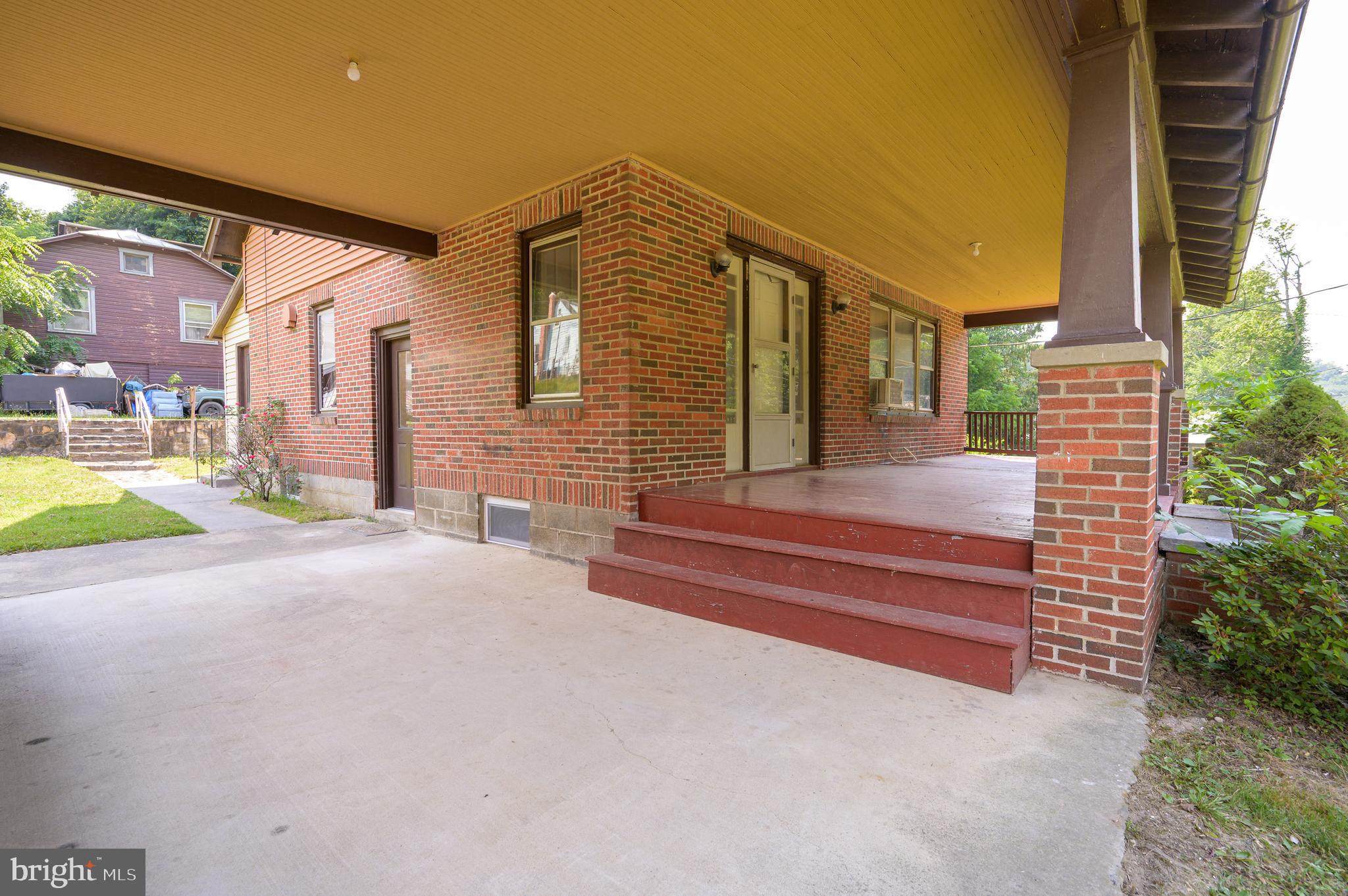 14 Peer Lane Berkeley Springs, WV 25411 - Photo 40 of 52 a yellow house with a outdoor view